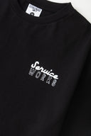 CAMISETA EATING ADVENTURES - NEGRA / SERVICE WORKS