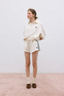 SHORT CRUDO LOGO TNS / THE NEW SOCIETY