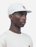 GORRA COLOR CRUDO CINCO PANELES FLOWER / OLOW